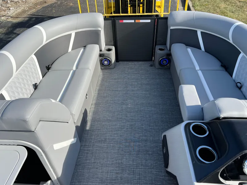 Slide: The Image of 2025 Crest CLASSIC 220 SLC pontoon boat interior with gray seating and modern design. - 29