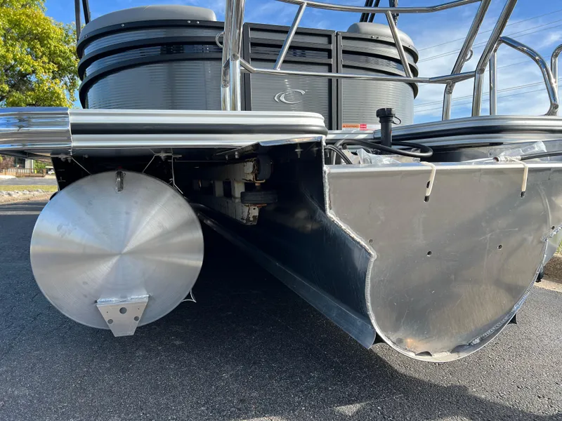 Slide: The Image of 2025 Crest CLASSIC 220 SLC pontoon boat, detailed view of aluminum pontoons and deck. - 8