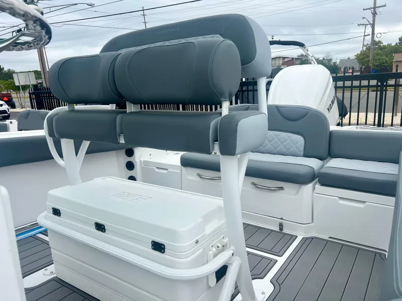 Slide: The Image of Luxurious interior of 2025 NauticStar 242OSL boat with cushioned seating and sleek design. - 8