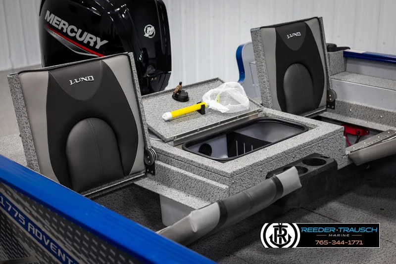 Slide: The Image of 2025 Lund 1775 Adventure SS boat interior with Mercury engine and fishing gear. - 13