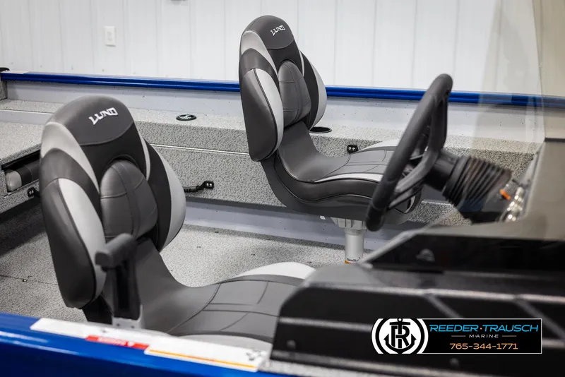 Slide: The Image of 2025 Lund 1775 Adventure SS boat interior with two black and gray seats. - 14