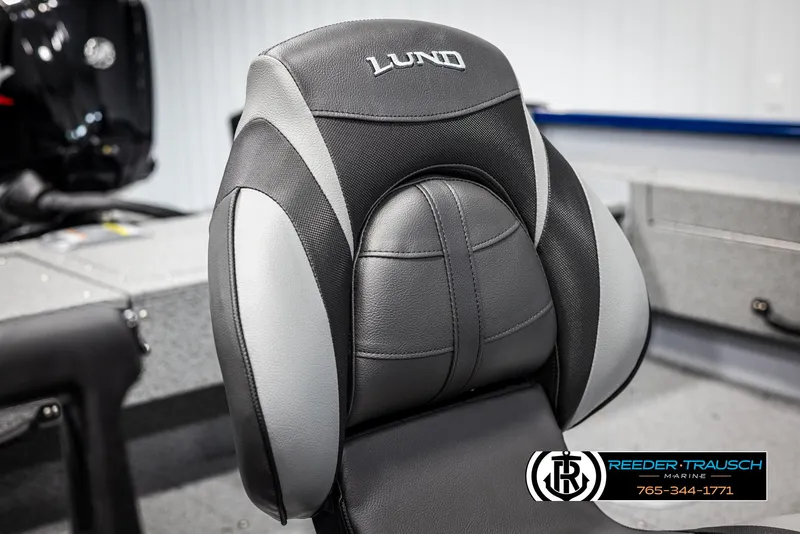 Slide: The Image of 2025 Lund 1775 Adventure SS boat seat, black and gray design, Reeder-Trausch Marine logo visible. - 23