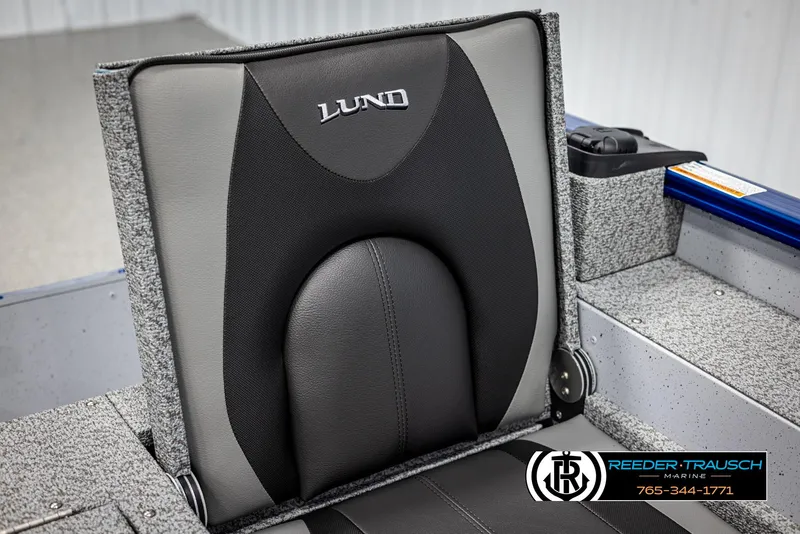 Slide: The Image of 2025 Lund 1775 Adventure SS boat seat with logo, featuring gray and black upholstery. - 24