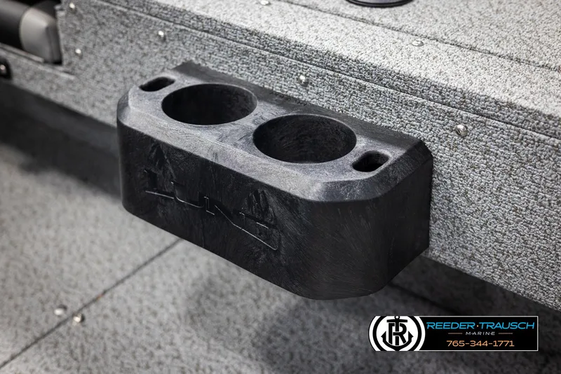 Slide: The Image of 2025 Lund 1775 Adventure SS boat cup holder, textured surface, Reeder-Trausch Marine branding. - 26