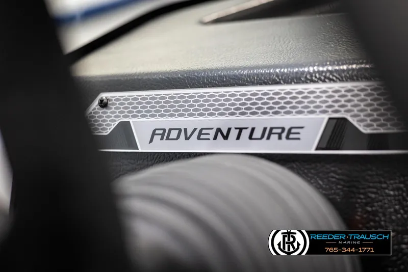 Slide: The Image of 2025 Lund 1775 Adventure SS boat dashboard with "Adventure" label, close-up view. - 28