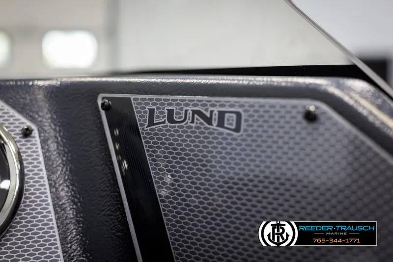 Slide: The Image of 2025 Lund 1775 Adventure SS dashboard with hexagonal pattern and logo detail. - 29