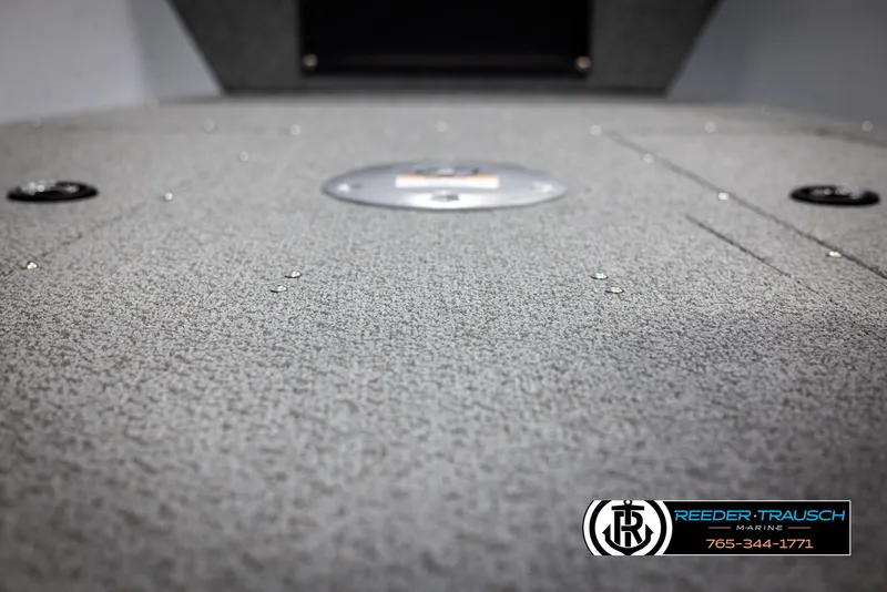 Slide: The Image of 2025 Lund 1775 Adventure SS boat interior with carpeted deck, Reeder-Trausch Marine logo. - 30