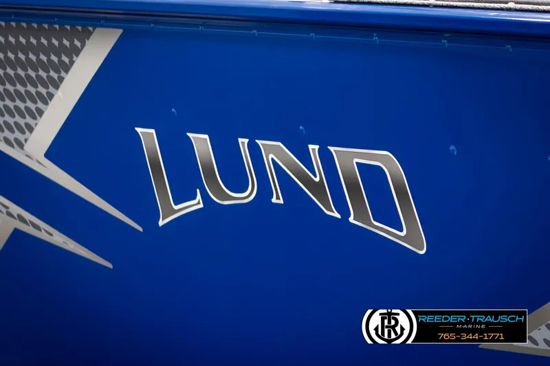 Slide: The Image of 2025 Lund 1775 Adventure SS boat logo on blue background. - 35