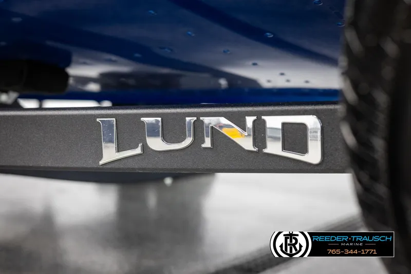 Slide: The Image of 2025 Lund 1775 Adventure SS boat logo close-up with Reeder-Trausch Marine branding. - 39