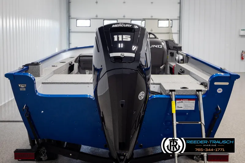 Slide: The Image of 2025 Lund 1775 Adventure SS boat with Mercury 115 engine in a garage setting. - 5