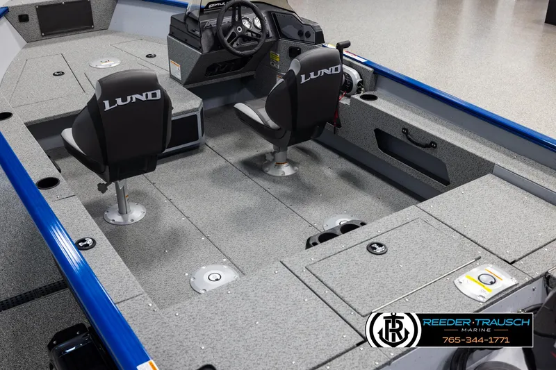 Slide: The Image of 2025 Lund 1775 Adventure SS boat interior with two seats and steering console. - 9