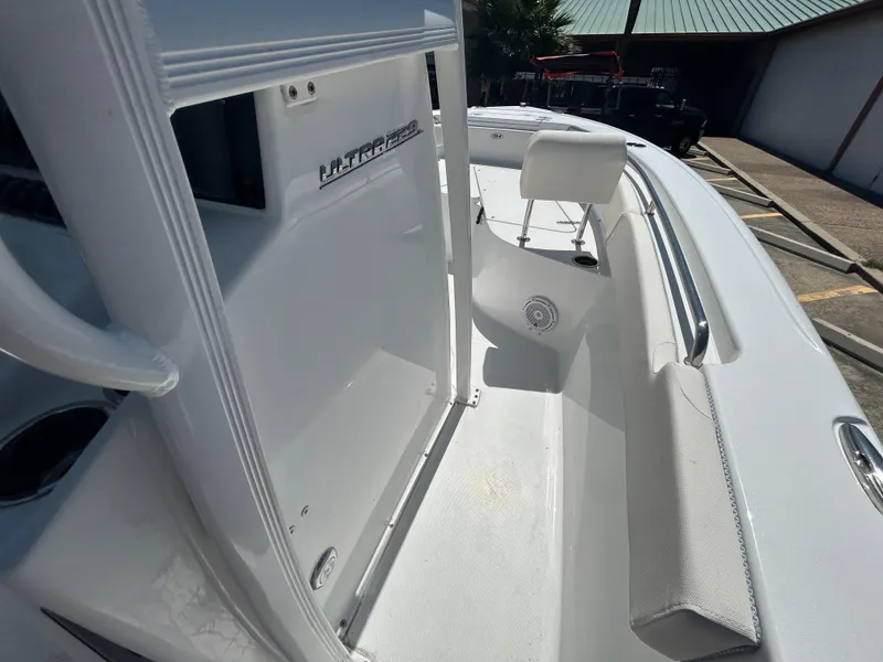 Slide: The Image of 2025 Sea Hunt Ultra 229 boat interior with white seating and sleek design. - 14