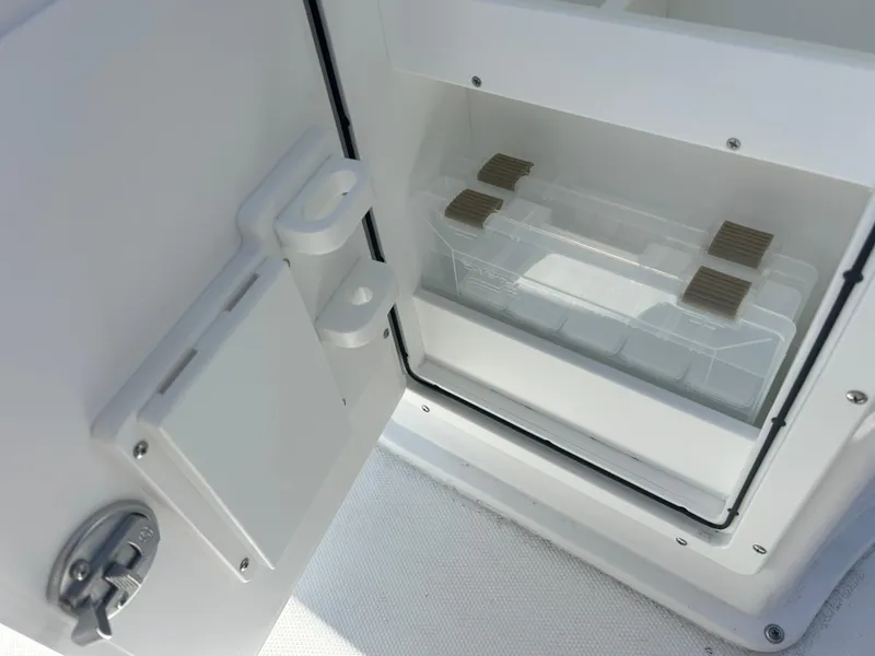 Slide: The Image of Open storage compartment on 2025 Sea Hunt Ultra 229 boat. - 19