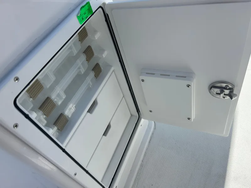 Slide: The Image of Open storage compartment on 2025 Sea Hunt Ultra 229 boat. - 20