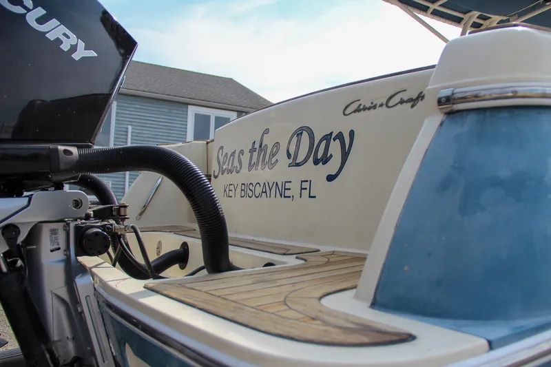 Slide: The Image of 2011 Chris-Craft Catalina 29 Sun Tender boat with "Seas the Day" text, Key Biscayne, FL. - 14