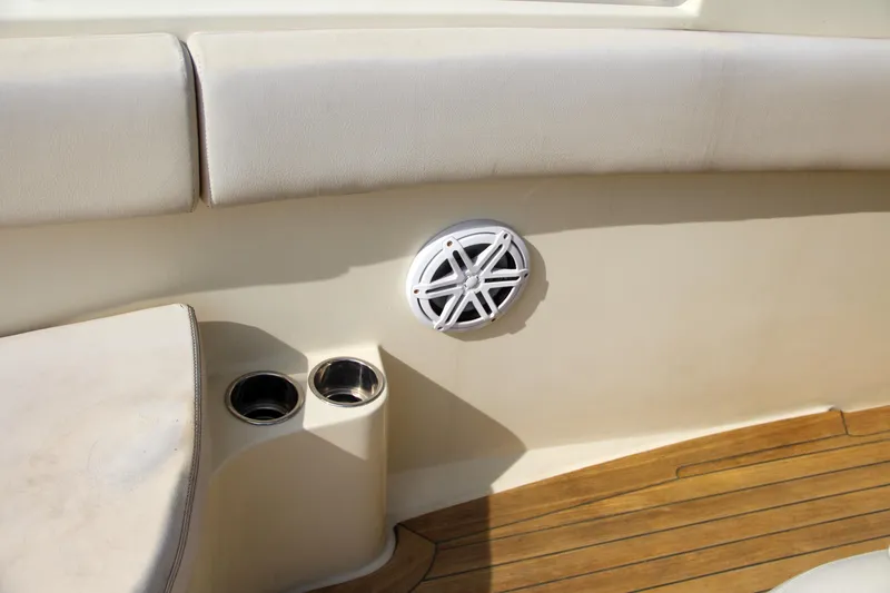 Slide: The Image of Chris-Craft Catalina 29 Sun Tender 2011 interior with speaker and cup holders. - 18