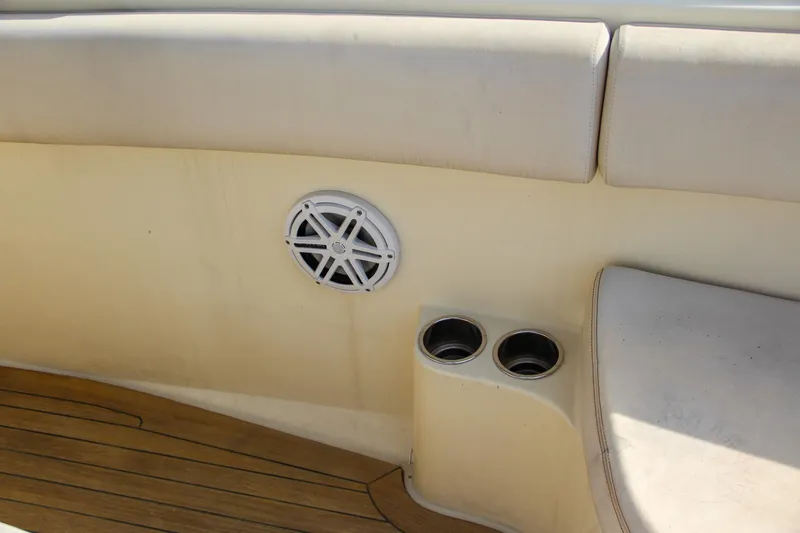 Slide: The Image of Interior of 2011 Chris-Craft Catalina 29 Sun Tender with speaker and cup holders. - 19