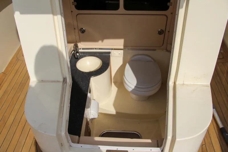 Slide: The Image of 2011 Chris-Craft Catalina 29 Sun Tender bathroom with sink and toilet. - 21
