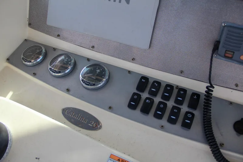 Slide: The Image of Control panel of 2011 Chris-Craft Catalina 29 Sun Tender with gauges and switches. - 24