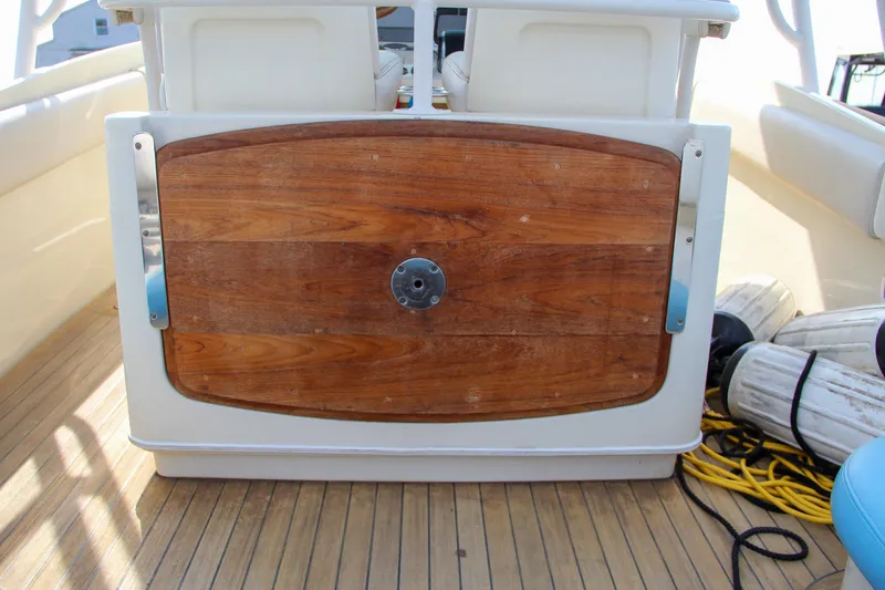 Slide: The Image of 2011 Chris-Craft Catalina 29 Sun Tender with wooden deck detail and nautical equipment. - 27