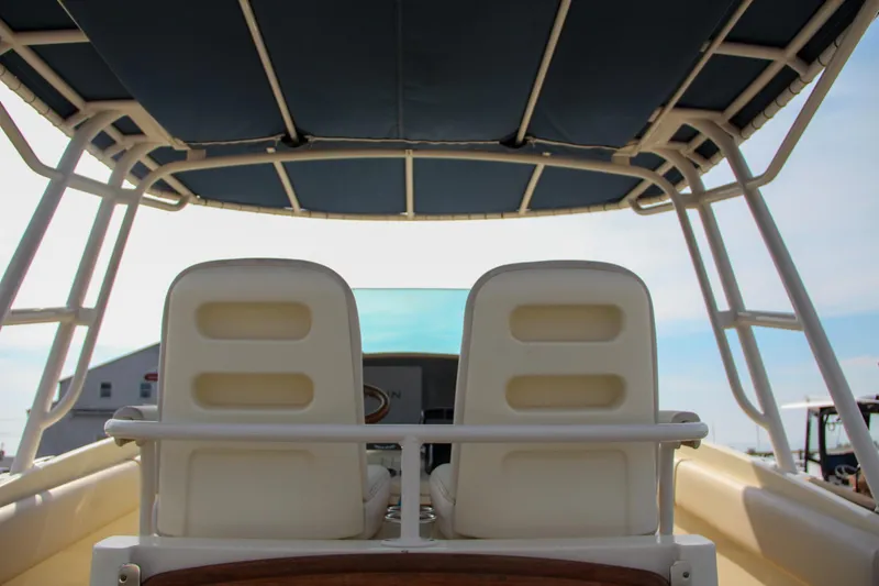 Slide: The Image of 2011 Chris-Craft Catalina 29 Sun Tender boat interior with dual seats and canopy. - 28