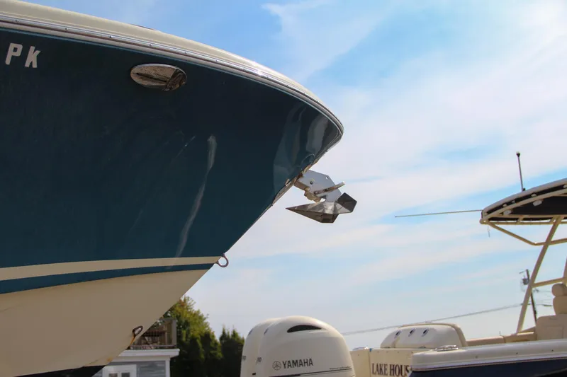 Slide: The Image of 2011 Chris-Craft Catalina 29 Sun Tender boat with Yamaha engines, docked under a clear sky. - 31