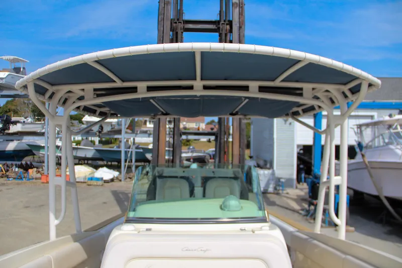 Slide: The Image of 2011 Chris-Craft Catalina 29 Sun Tender boat with T-top in a marina setting. - 8