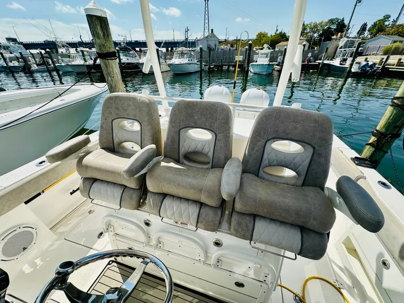 Slide: The Image of 2019 Sea Fox 328 Commander boat seats at marina dock. - 19