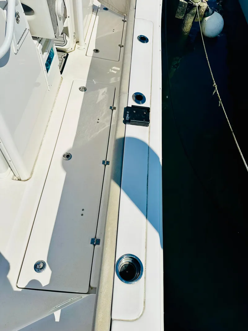 Slide: The Image of 2019 Sea Fox 328 Commander boat deck with rod holders and clean design. - 5