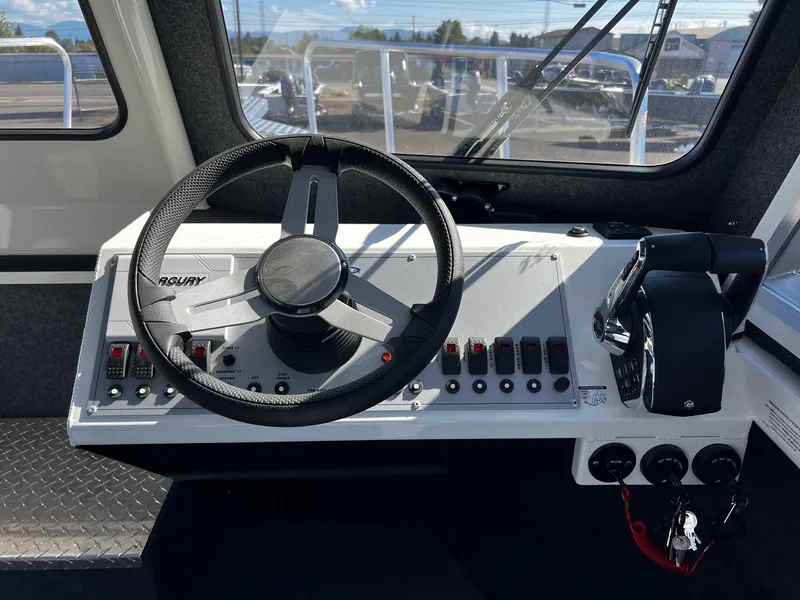 Slide: The Image of 2024 Thunder Jet 26 Alexis Pro XL boat dashboard with steering wheel and controls. - 10