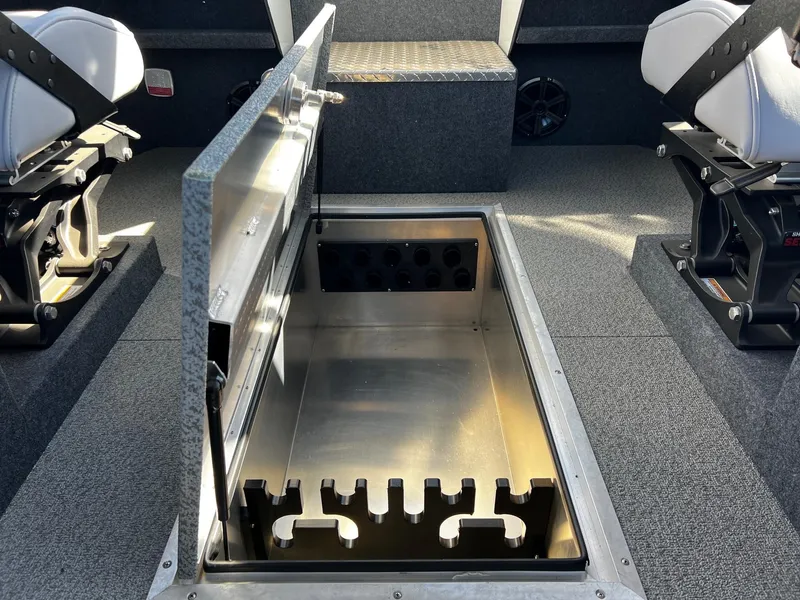 Slide: The Image of 2024 Thunder Jet 26 Alexis Pro XL interior with open storage compartment. - 13