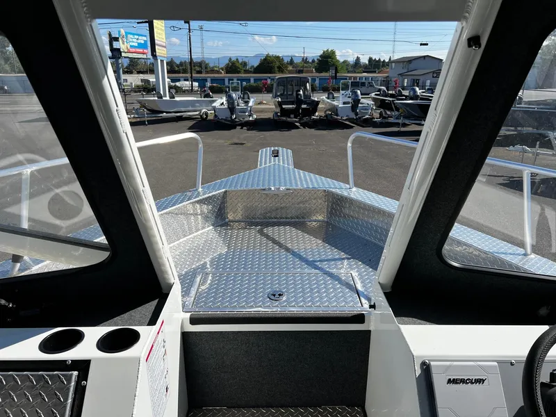 Slide: The Image of 2024 Thunder Jet 26 Alexis Pro XL boat interior with aluminum deck and windshield view. - 15