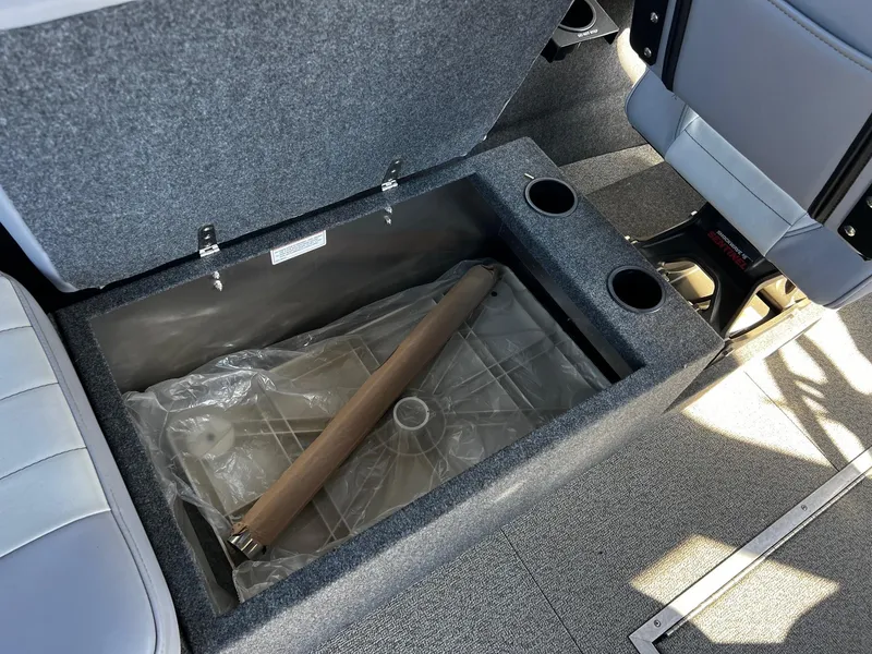 Slide: The Image of 2024 Thunder Jet 26 Alexis Pro XL interior storage compartment with cup holders. - 20