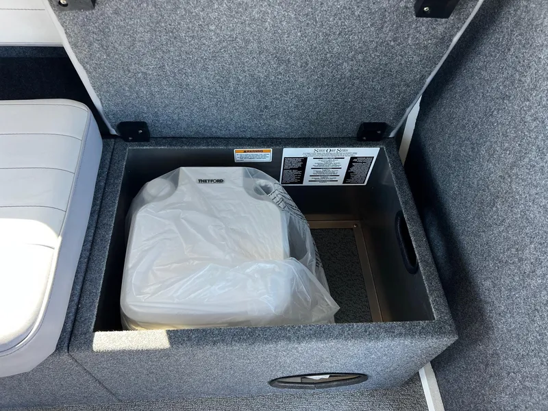 Slide: The Image of 2024 Thunder Jet 26 Alexis Pro XL interior storage compartment with portable toilet. - 23
