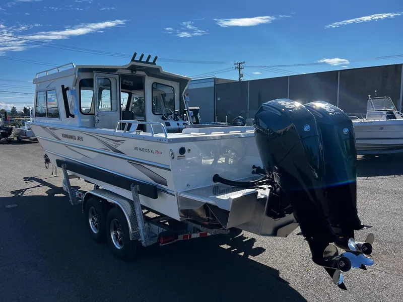 Slide: The Image of 2024 Thunder Jet 26 Alexis Pro XL boat with dual outboard motors on a trailer. - 3