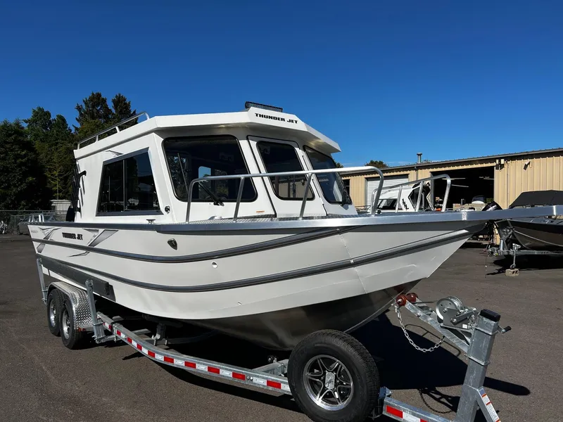 Slide: The Image of 2024 Thunder Jet 26 Alexis Pro XL boat on trailer, parked outdoors. - 6