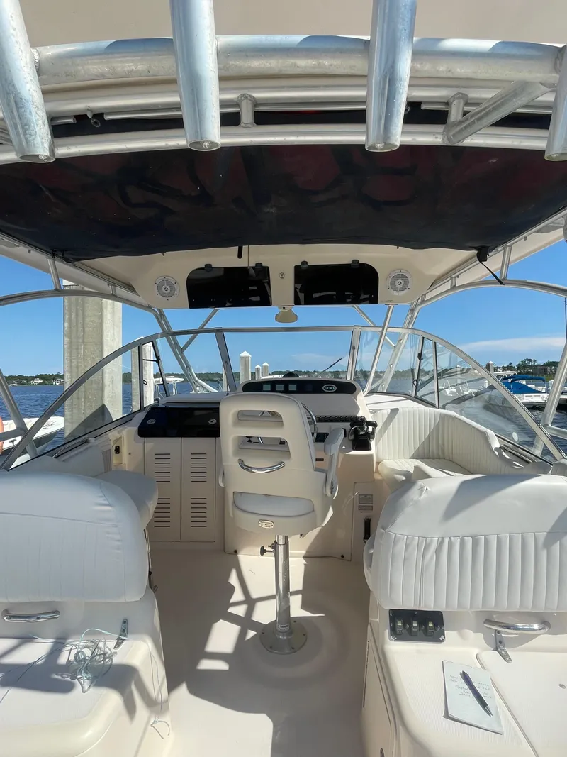 Slide: The Image of 2008 Grady-White Open Express boat interior with helm and seating. - 14