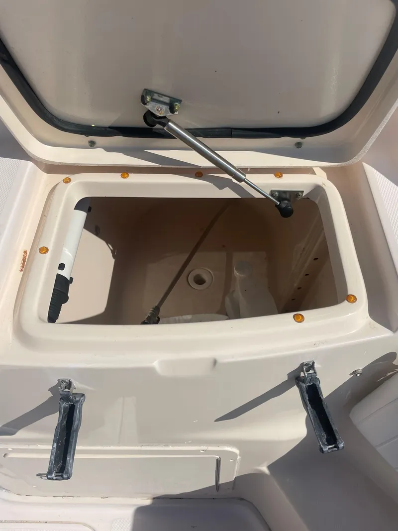 Slide: The Image of Open storage compartment on 2008 Grady-White Open Express boat. - 21