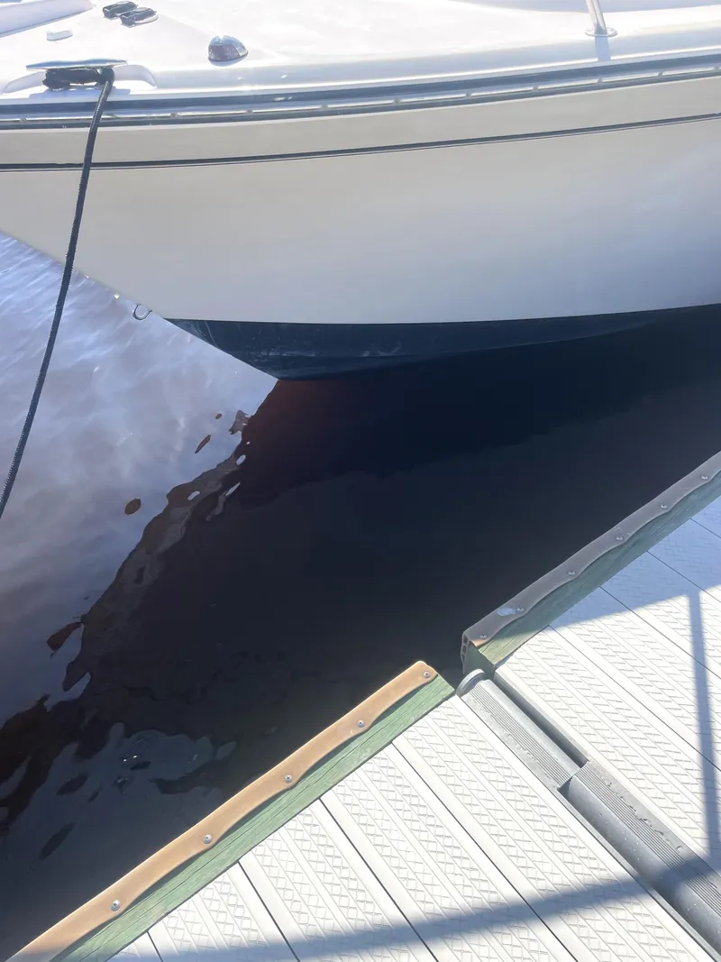 Slide: The Image of 2008 Grady-White Open Express boat docked at marina. - 22