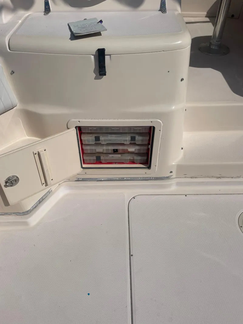 Slide: The Image of 2008 Grady-White Open Express boat storage compartment with open hatch. - 23
