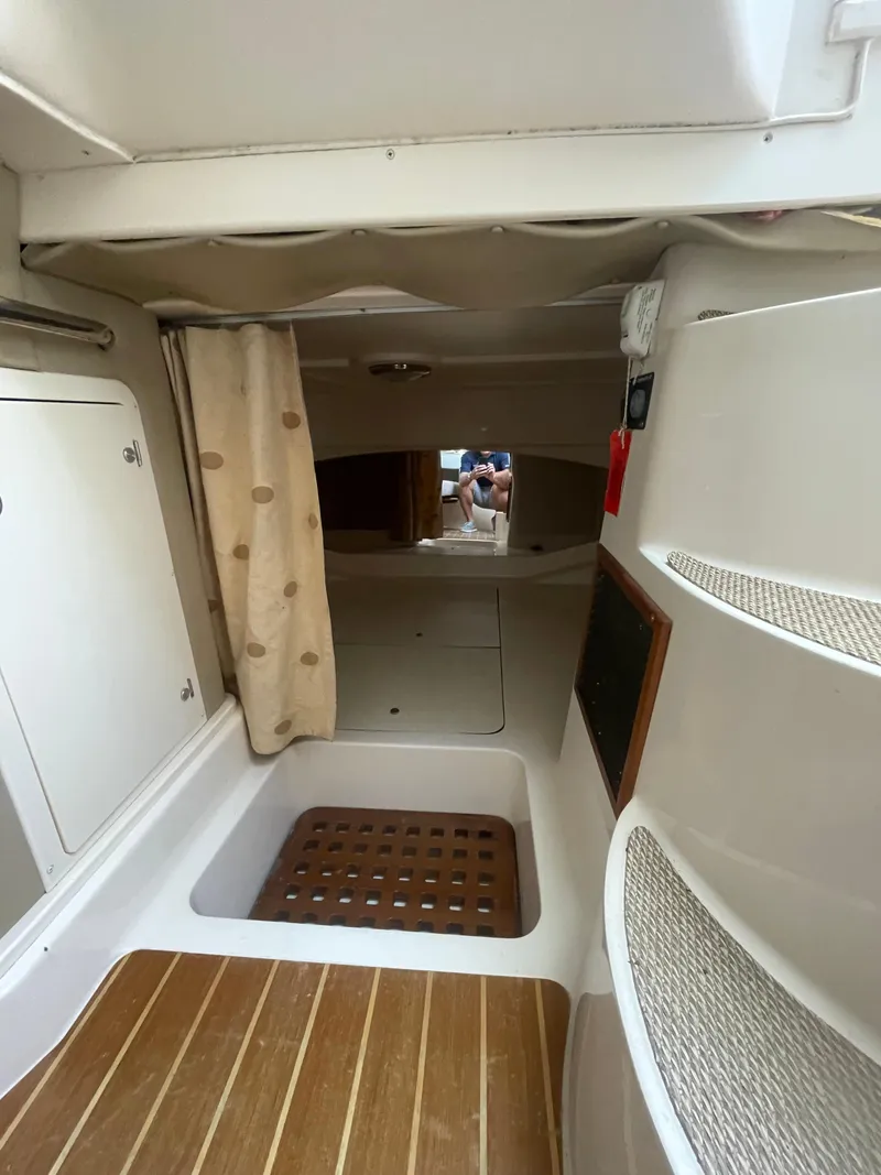 Slide: The Image of Interior cabin of 2008 Grady-White Open Express boat with wooden flooring. - 31