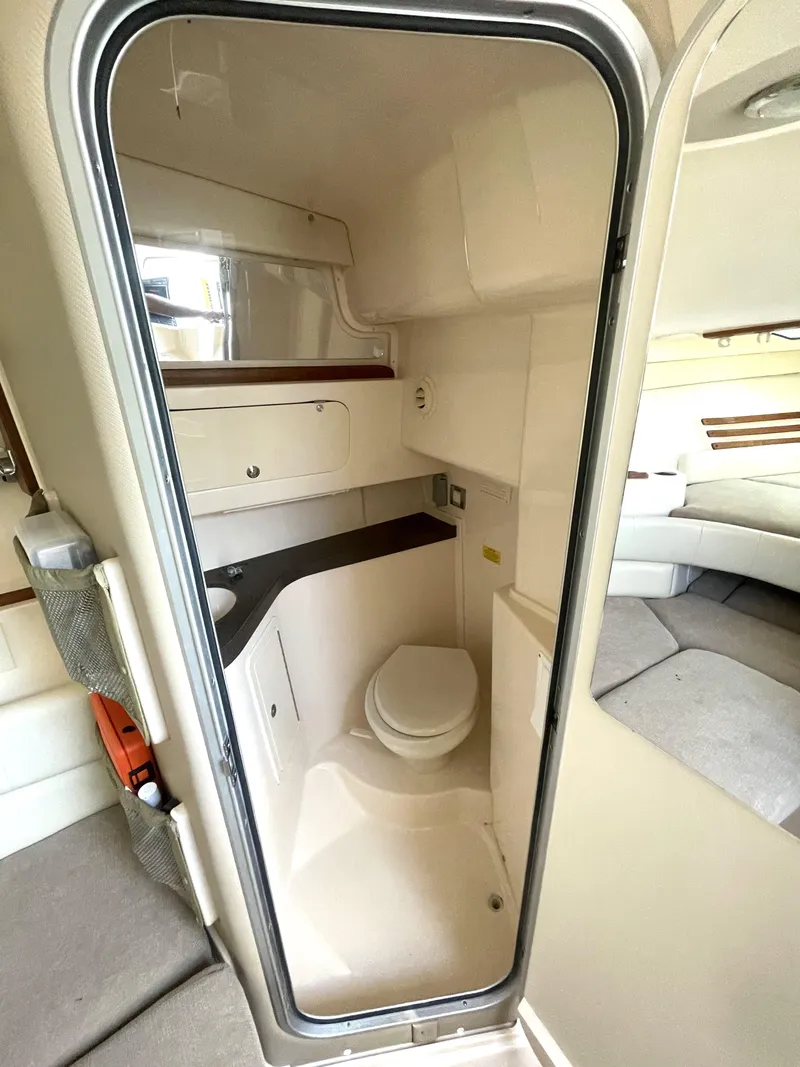 Slide: The Image of 2008 Grady-White Open Express boat interior bathroom with compact design and modern amenities. - 32