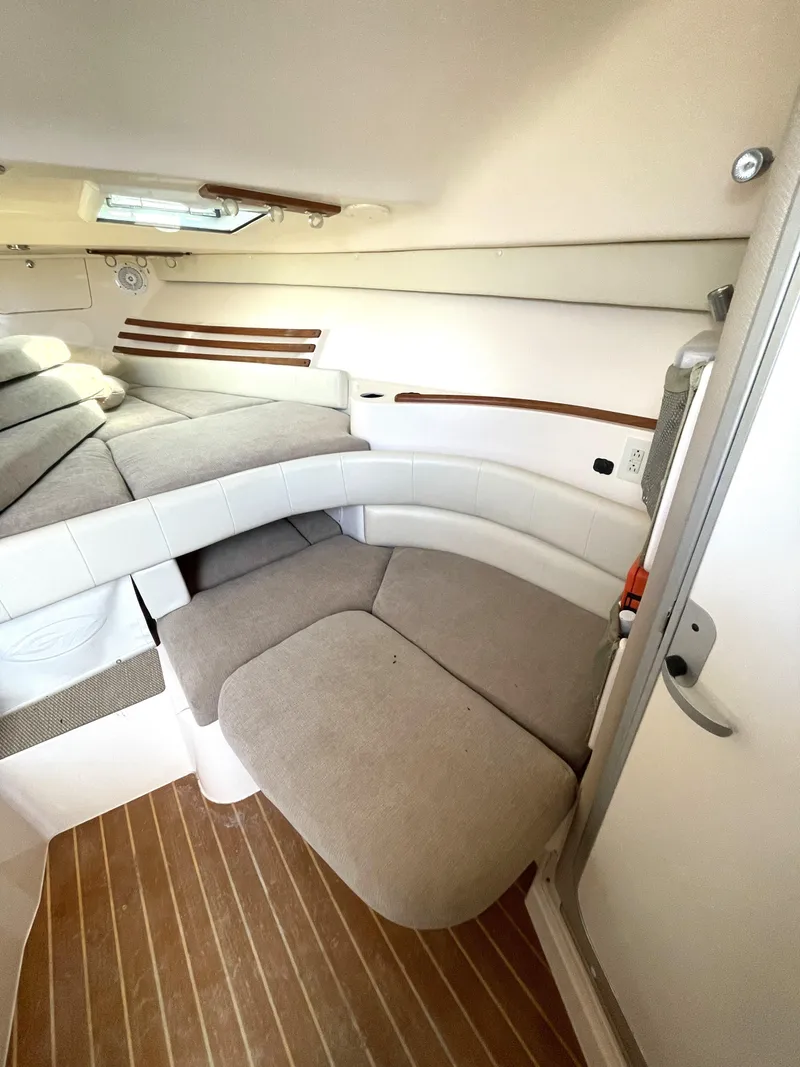 Slide: The Image of 2008 Grady-White Open Express cabin interior with cushioned seating and wood flooring. - 33