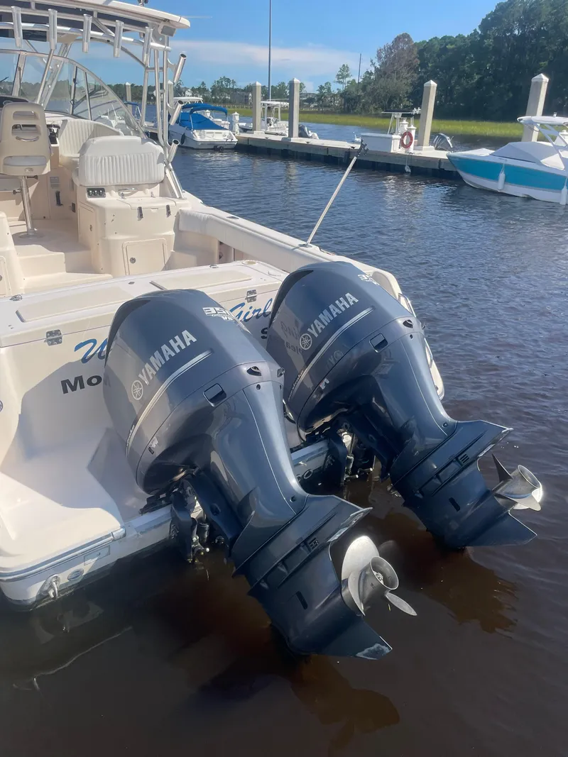Slide: The Image of 2008 Grady-White Open Express boat with twin Yamaha outboard motors docked at marina. - 4