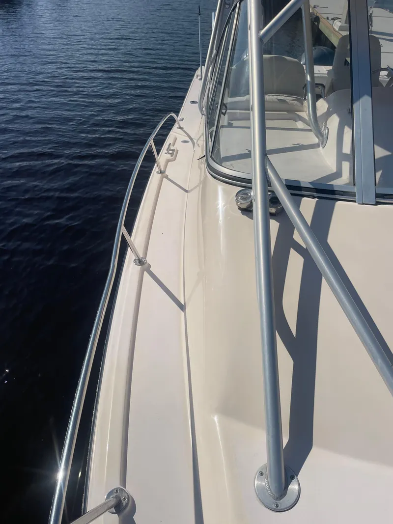 Slide: The Image of 2008 Grady-White Open Express boat deck with railing on calm water. - 6