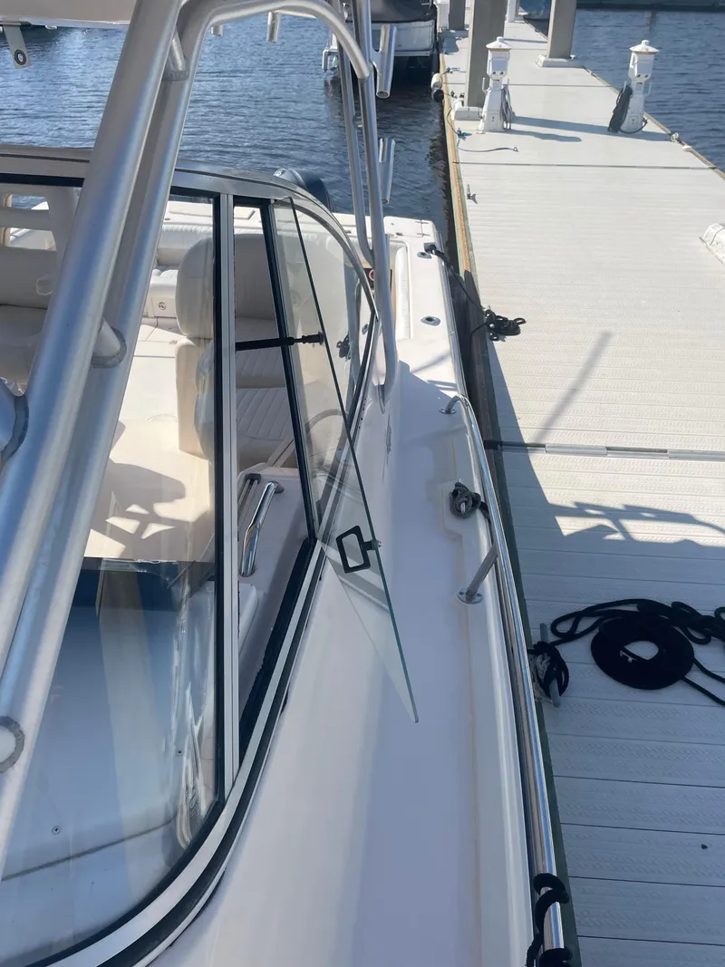 Slide: The Image of 2008 Grady-White Open Express boat docked at marina. - 7