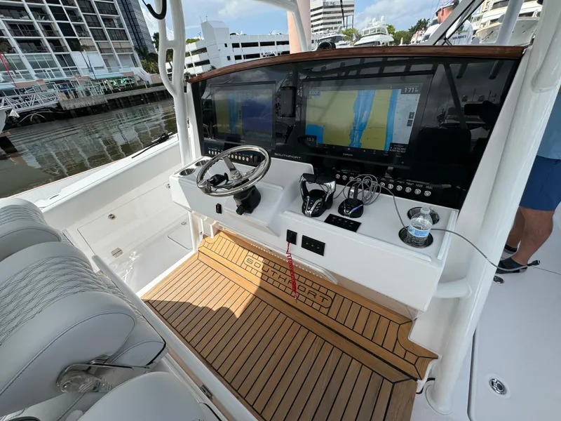 Slide: The Image of 2025 Southport 38 FE boat cockpit with advanced navigation system and luxurious seating. - 17
