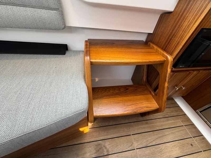 Slide: The Image of Wooden steps and seating in 2025 Southport 38 FE boat interior. - 7