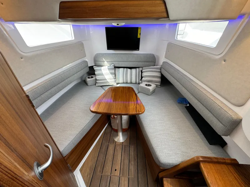 Slide: The Image of Luxurious interior of 2025 Southport 38 FE boat with cozy seating and modern amenities. - 9
