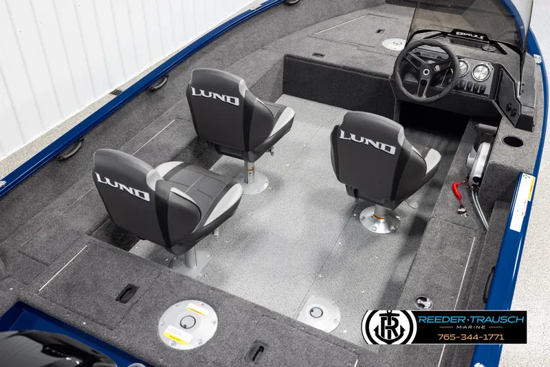 Slide: The Image of 2025 Lund Rebel XL SS boat interior with two seats and steering console. - 10